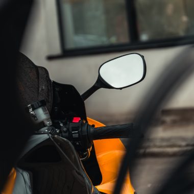 a close up of the side mirror of a motorcycle
