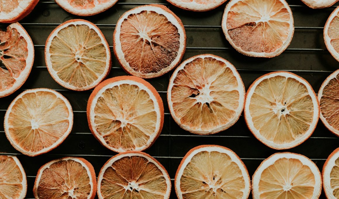 a bunch of oranges that are on a rack