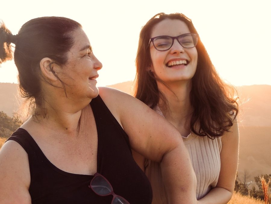 woman in black tank top beside woman in white tank top