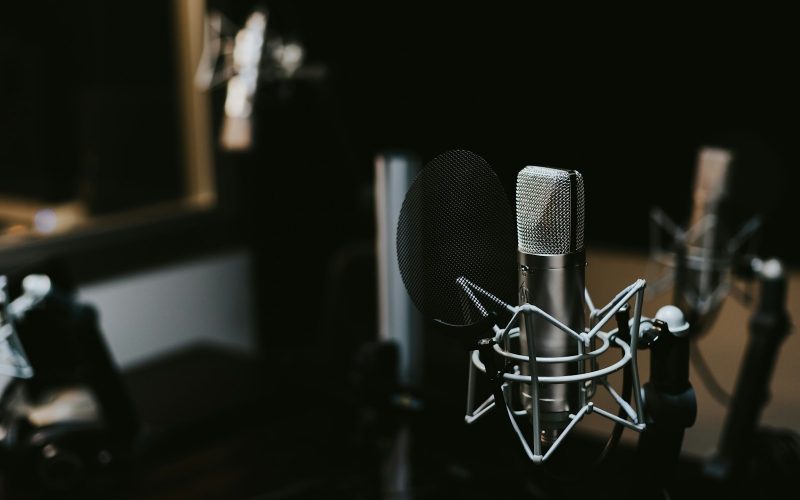 macro photography of silver and black studio microphone condenser